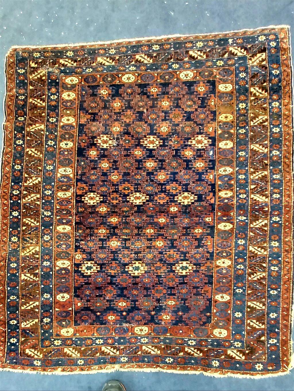 A Caucasian Kuba blue ground rug, 130 x 120cm